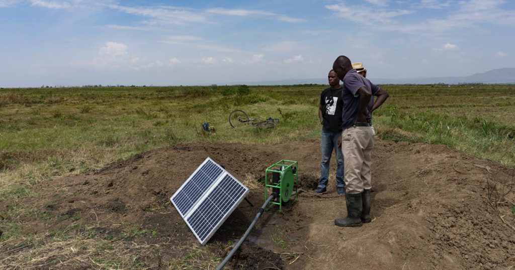 Japheth showing his SF2 solar pump, reducing the effort of irrigation.